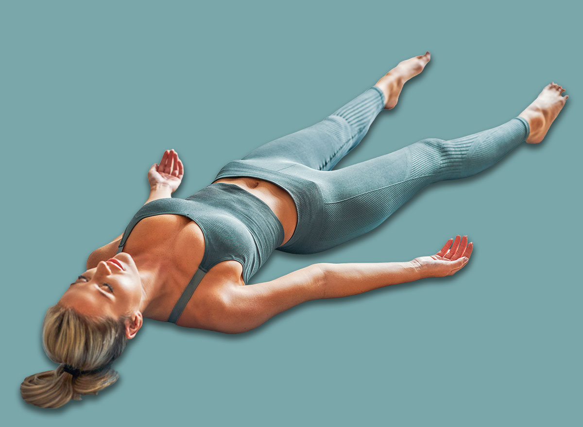 Adult woman practising yoga at home