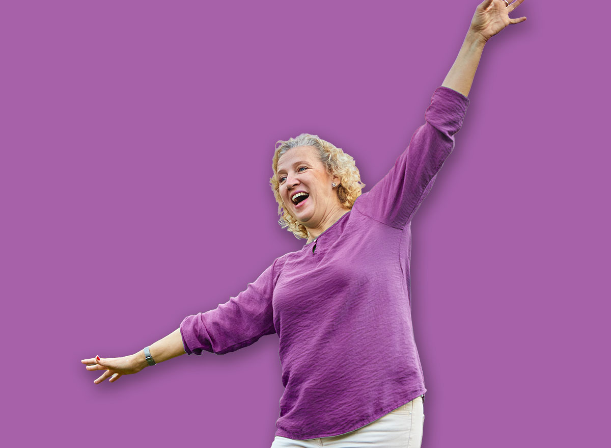 Happy active mid aged adult couple having fun walking and balancing and bonding in park or nature outdoors, healhty active mature people exercise concept