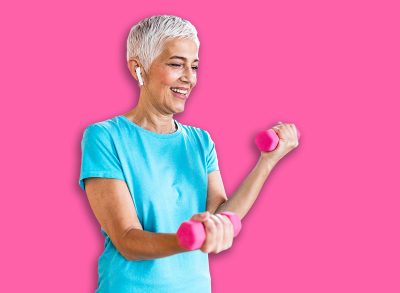 Senior woman exercise with dumbbells at home . happy mature woman doing arm workout using dumbbells. Elderly woman prefers healthy lifestyle