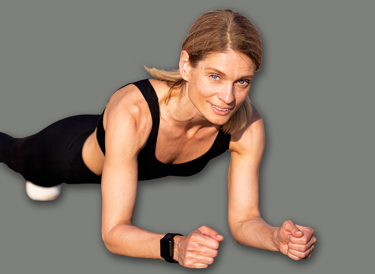 Athletic Middle Aged Female Training Outdoors, Making Plank Exercise, Beautiful Sporty Woman In Activewear Exercising On Wooden Pier, Enjoying Outside Workouts, Closeup Shot With Copy Space