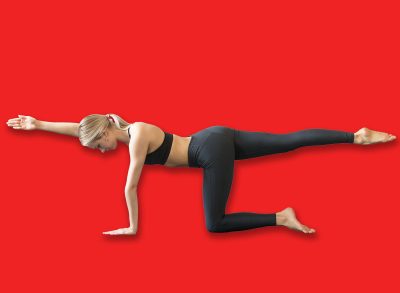 Young attractive woman practicing yoga, stretching in Bird dog exercise, Donkey kick pose, working out, wearing sportswear, black top and pants, indoor full length, studio background