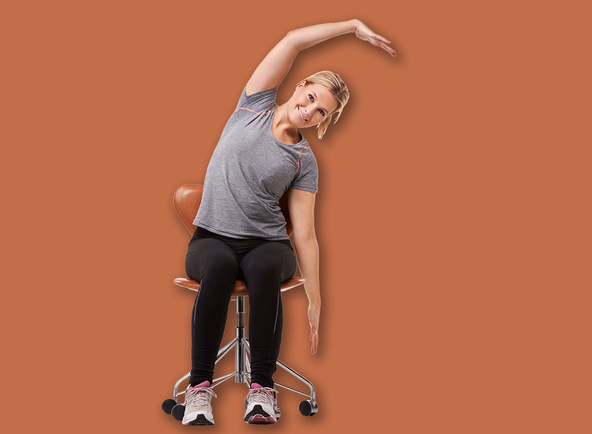 Office, chair and portrait of woman stretching for posture, health and fitness in white background or studio. Sitting, exercise and person training with seated arm stretches or practice for wellness