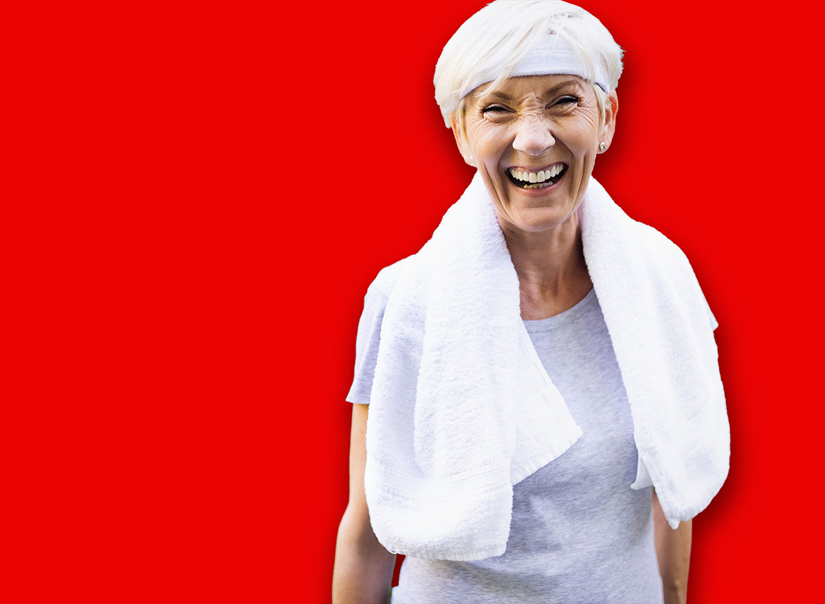 Portrait of smiling sporty senior woman outdoor
