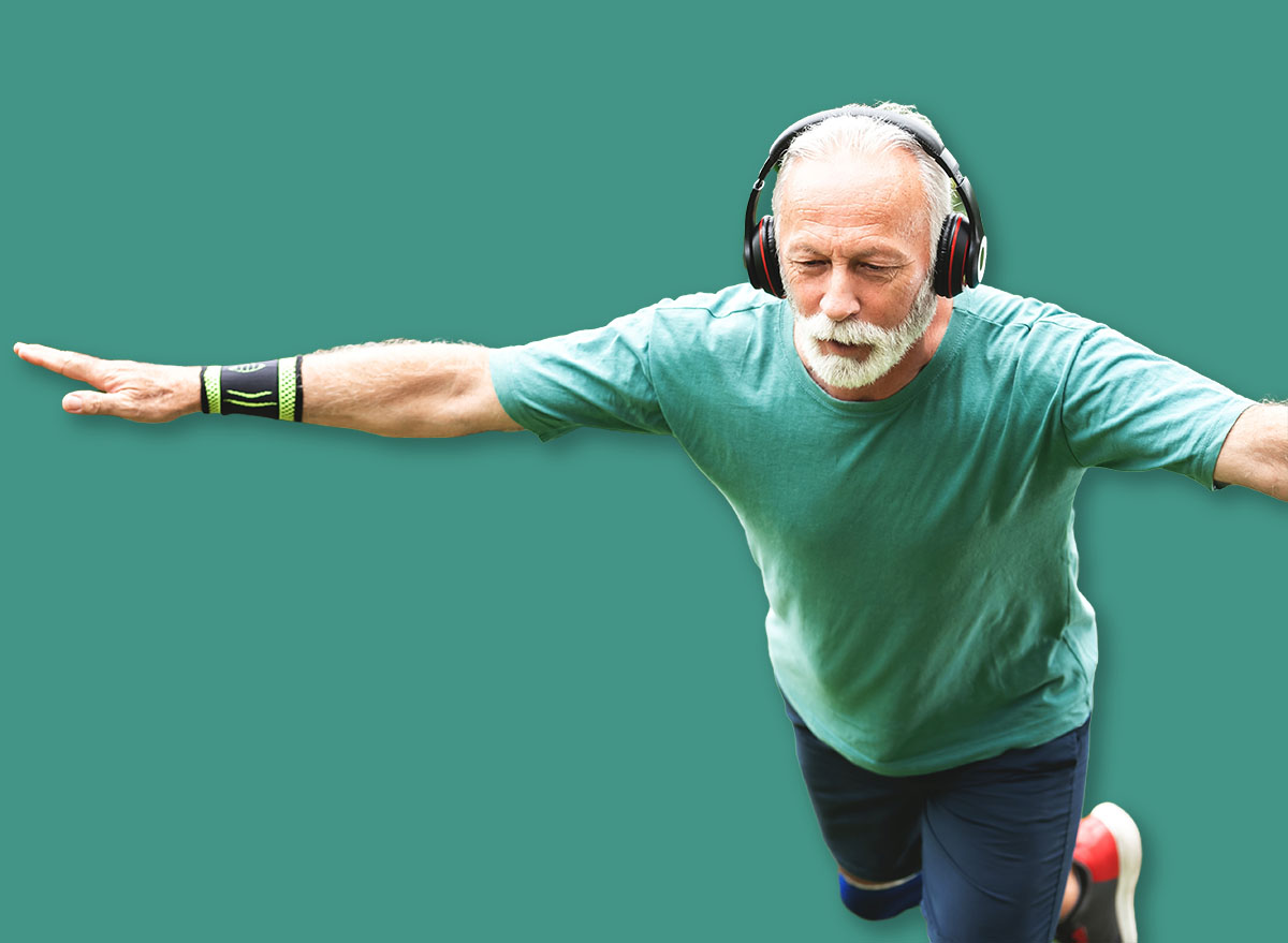 Senior man doing single leg forward bend exercise