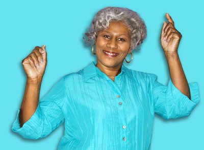 Mature adult African American female dancing.