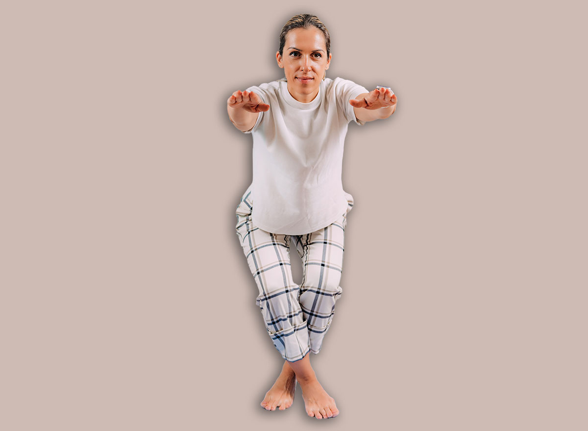 Functional Fitness Test. SRT. Woman Doing Sitting and Rising Test at Home
