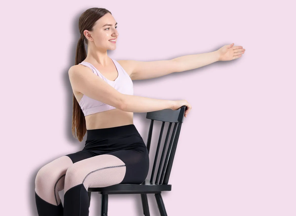 Beautiful woman stretching on chair at home