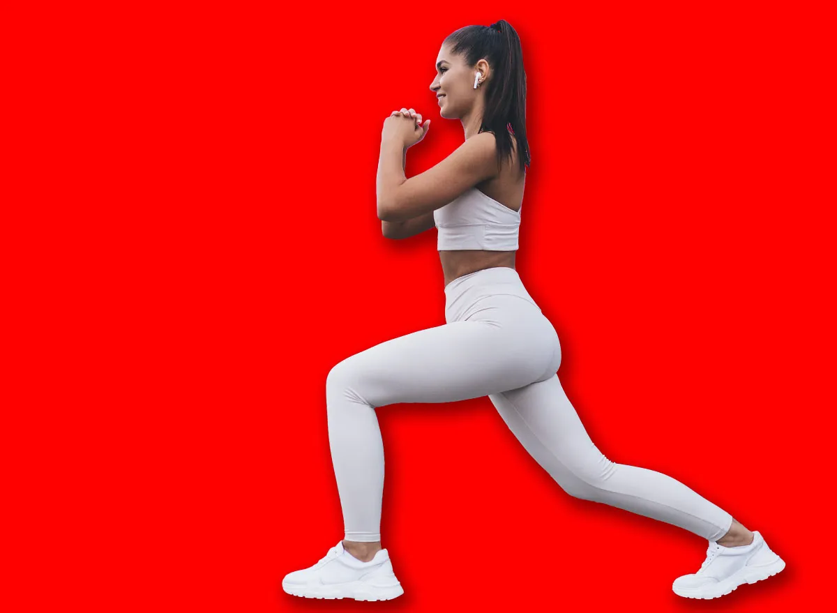 Young happy woman makes deep forward lunges to pump the muscles of the legs and buttocks, simple and effective exercises during morning jog around city. Healthy lifestyle and keeping the body in shape