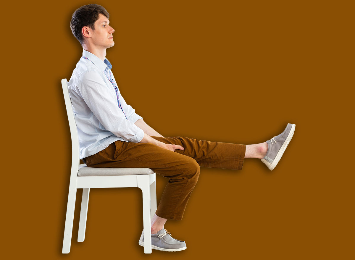Young guy office worker doing exercises on