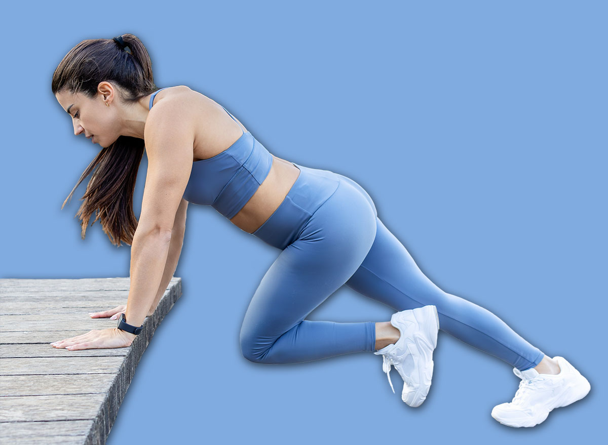 Woman doing intense cardio and core training with incline mountain climbers