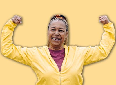 Senior African woman doing exercise workout routine outdoor - Focus on face