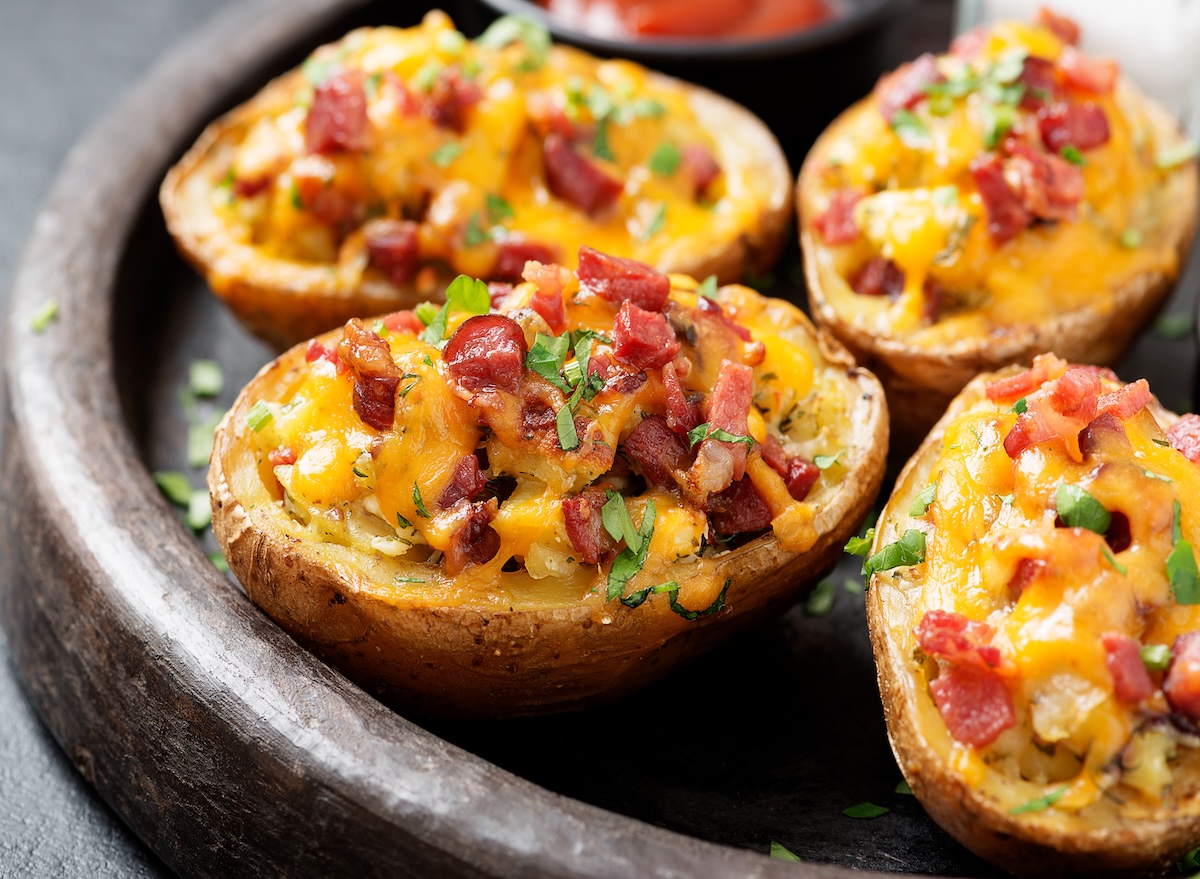 Hot,Baked,Potato,Topped,With,Bacon,,Green,Onions,And,Cheddar