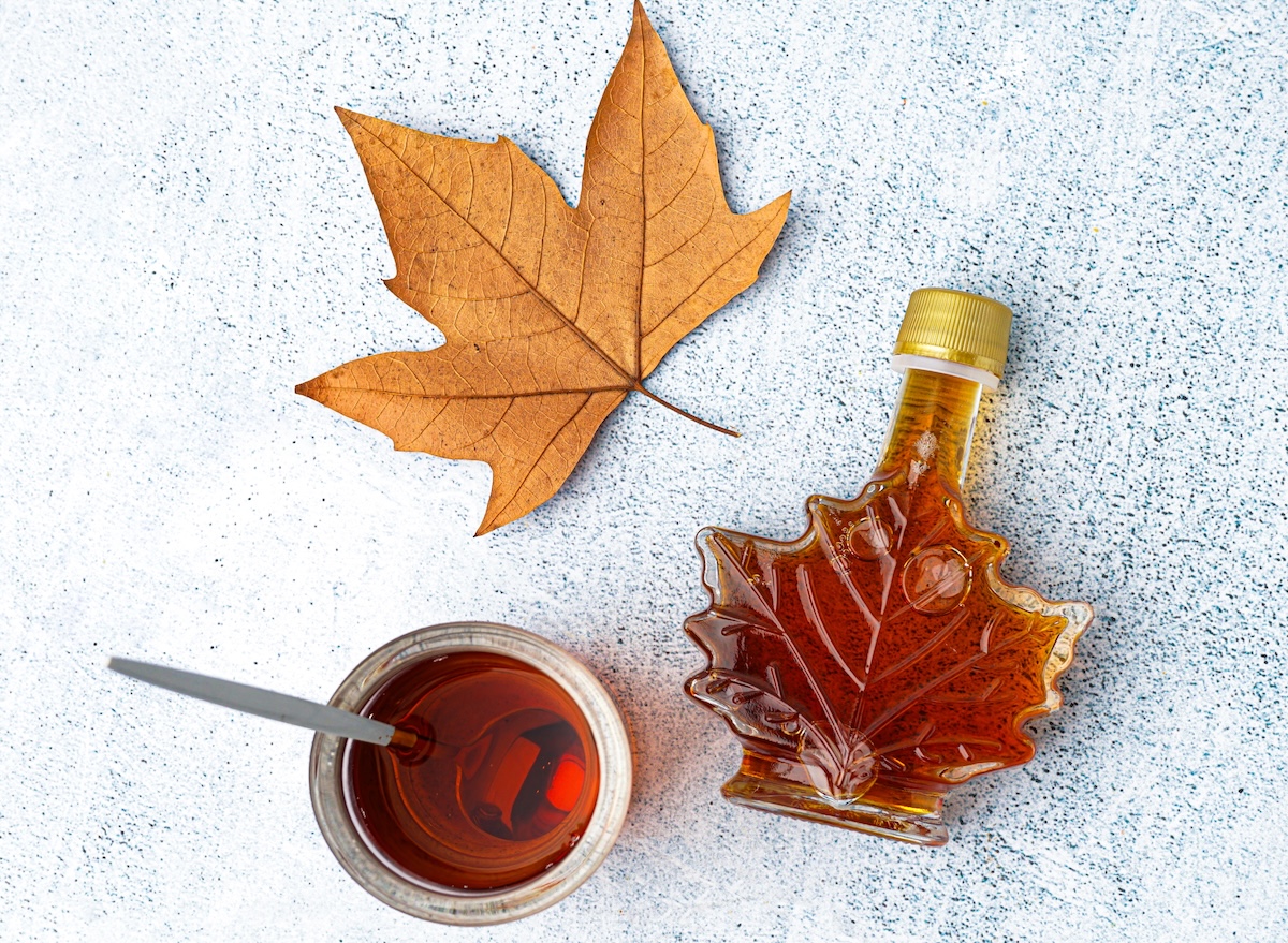 Bottle,And,Glass,Of,Tasty,Maple,Syrup,On,Grey,Background