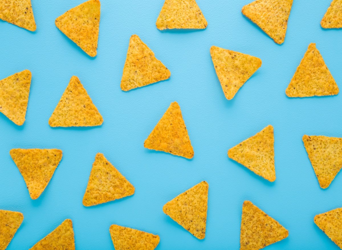 Yellow,Tortilla,Chips,On,Light,Blue,Table,Background.,Pastel,Color.