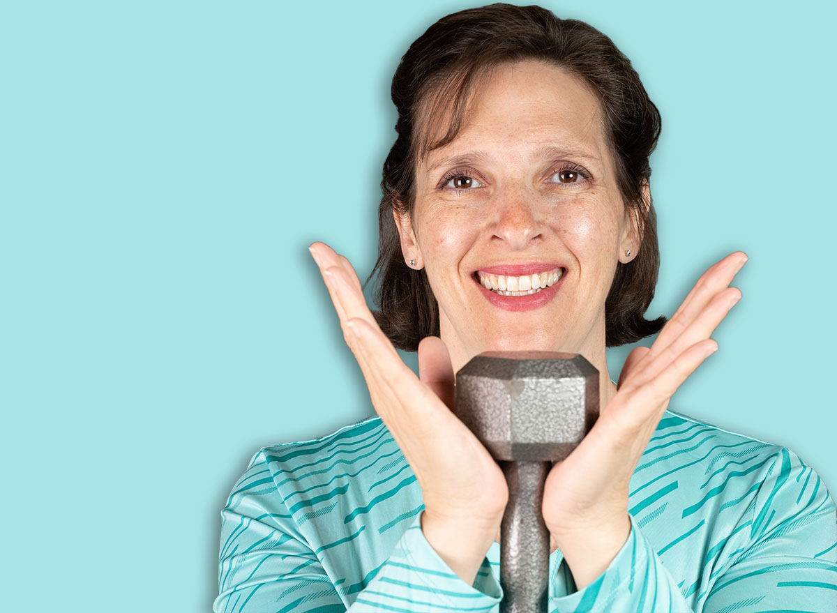 Older average looking woman doing a goblet squat. Happy and healthy active lifestyle concept image.