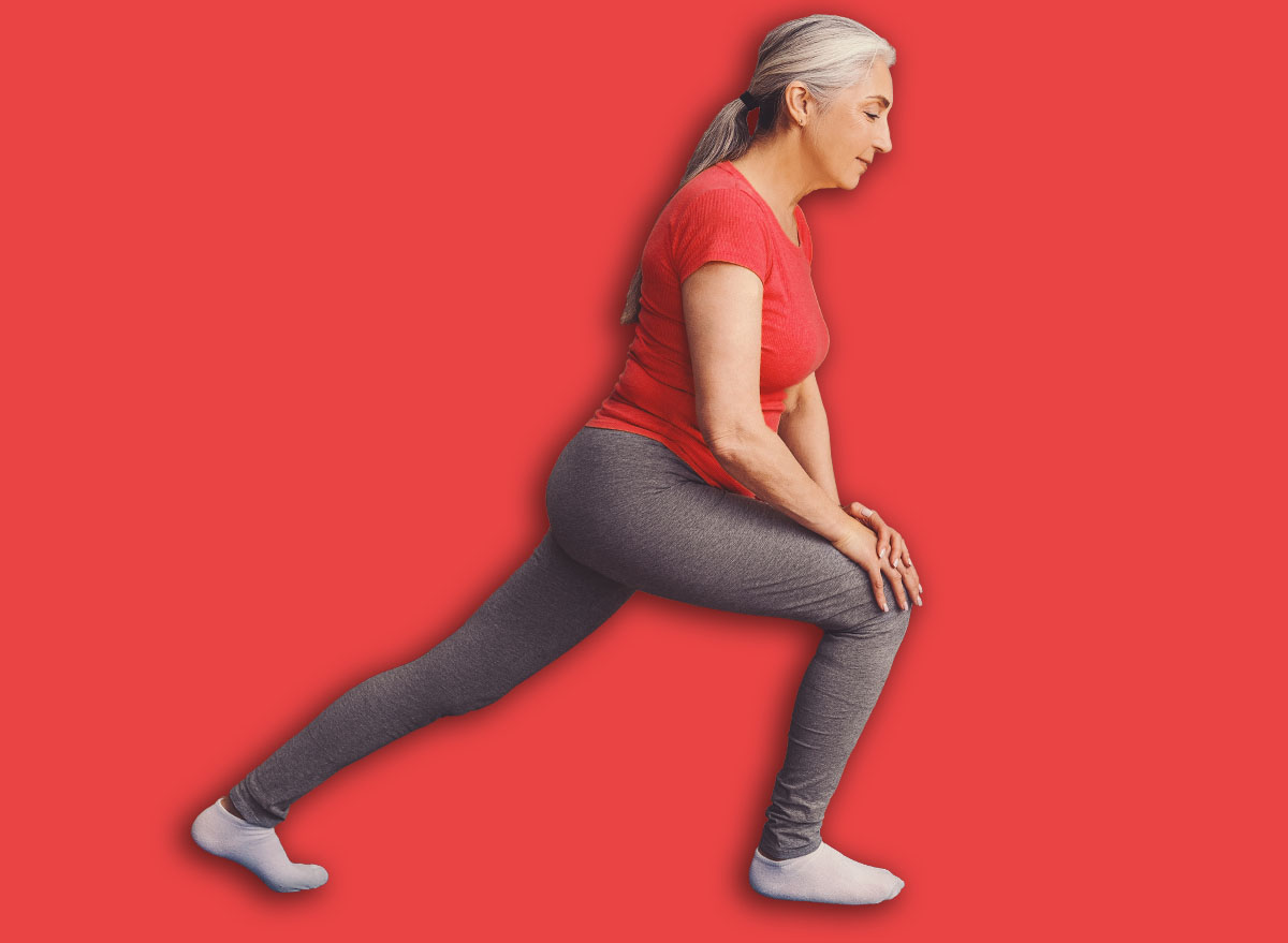 Senior Woman Practicing Lunges At Home With Laptop, Fitness And Health Concept