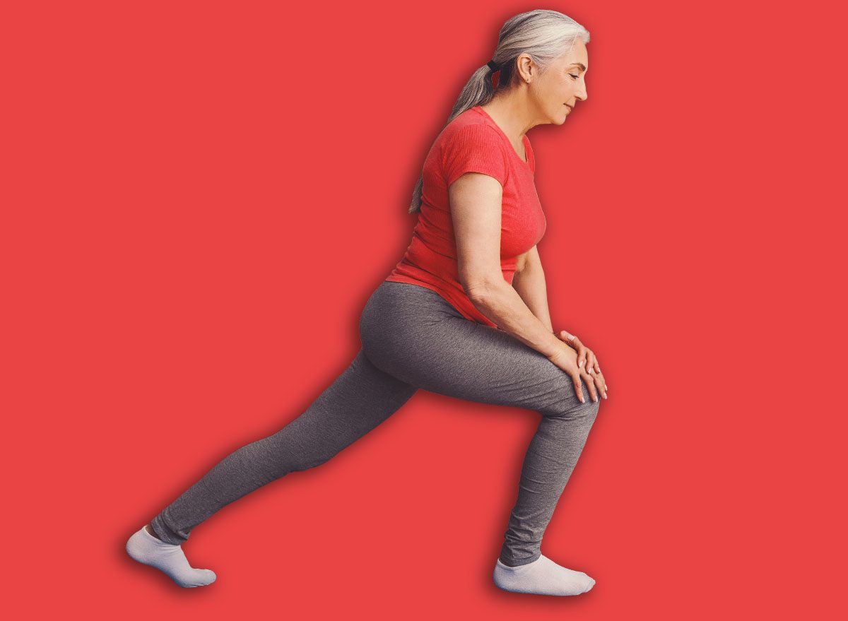 Senior Woman Practicing Lunges At Home With Laptop, Fitness And Health Concept