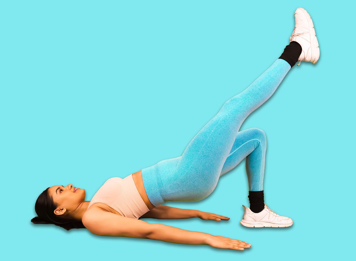 Single Leg Glute Bridge Exercise Done by Young Indian Fit Gym Girl