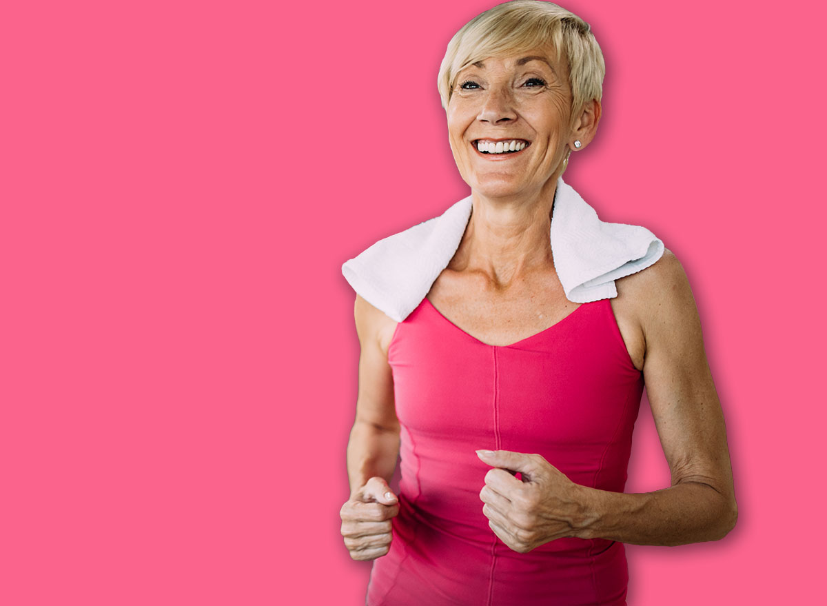 Senior people running on a treadmill in health club.