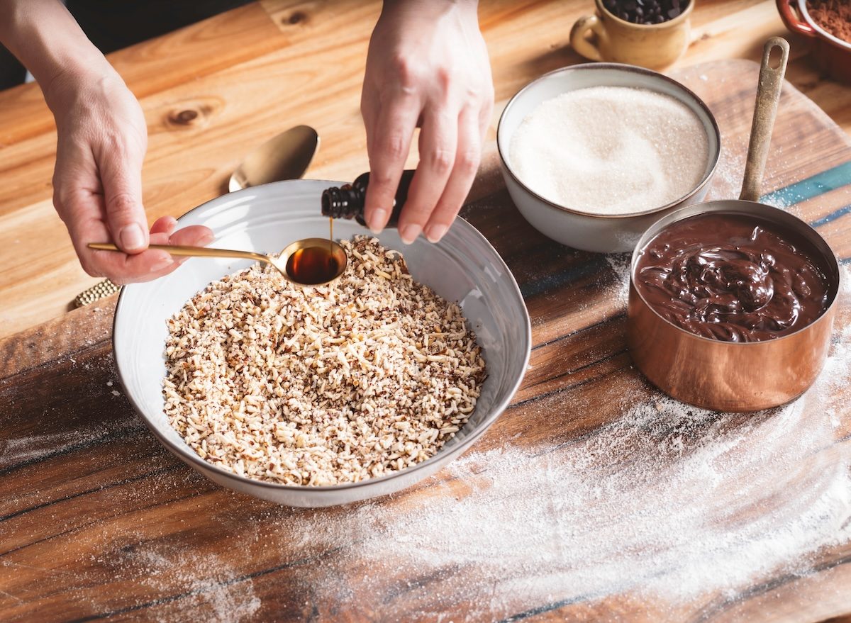 A,Person,Prepares,A,Baking,Recipe,,Carefully,Adding,Vanilla,Extract