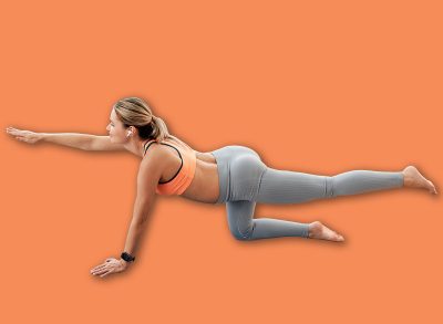 Pregnant woman practicing fitness on yoga mat at home, performing bird dog exercise in bright living room. Concept of healthy pregnancy and active lifestyle.