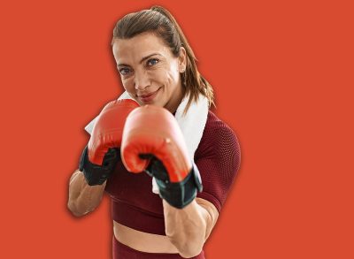 Middle age caucasian sporty woman boxing at home.