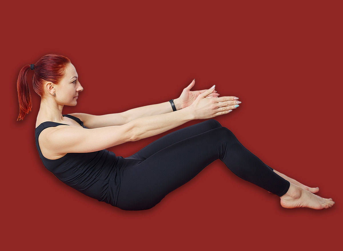 Pilates exercise roll back. A slender woman performs an exercise to strengthen and stretch her back and lumbar spine. Smart fitness for the body. Isolated on a white background. Visual aid for the