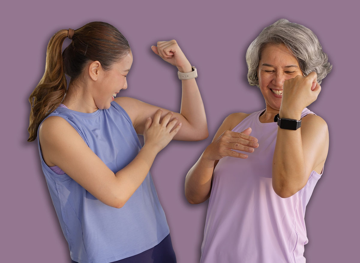 Young adult child and middle age old mum smile look at camera gym workout body weight picking up arm lift dumbbell. Health care older mom asia elder people happy protect aging life sport build muscle.