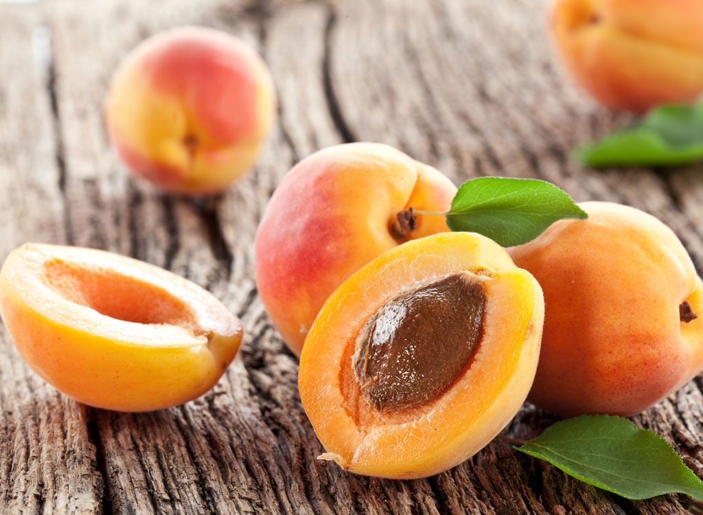 peach halves on wooden tabletop