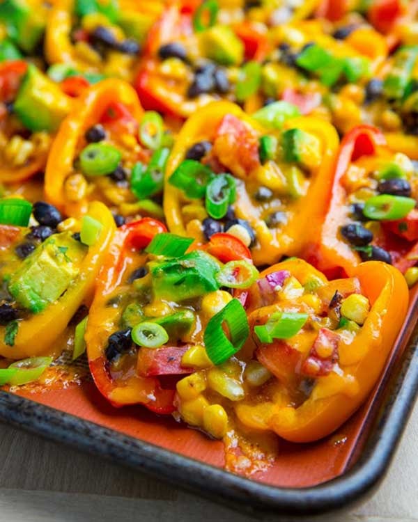 mini pepper nachos with corn, black beans and avocado