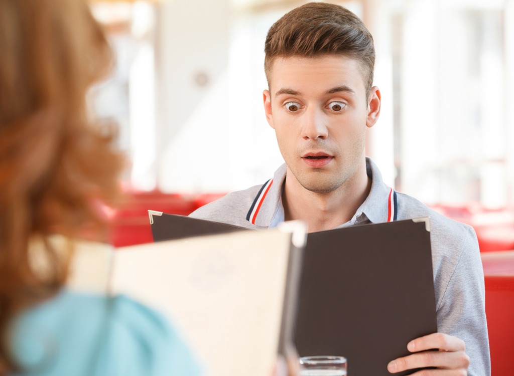 man shocked at menu