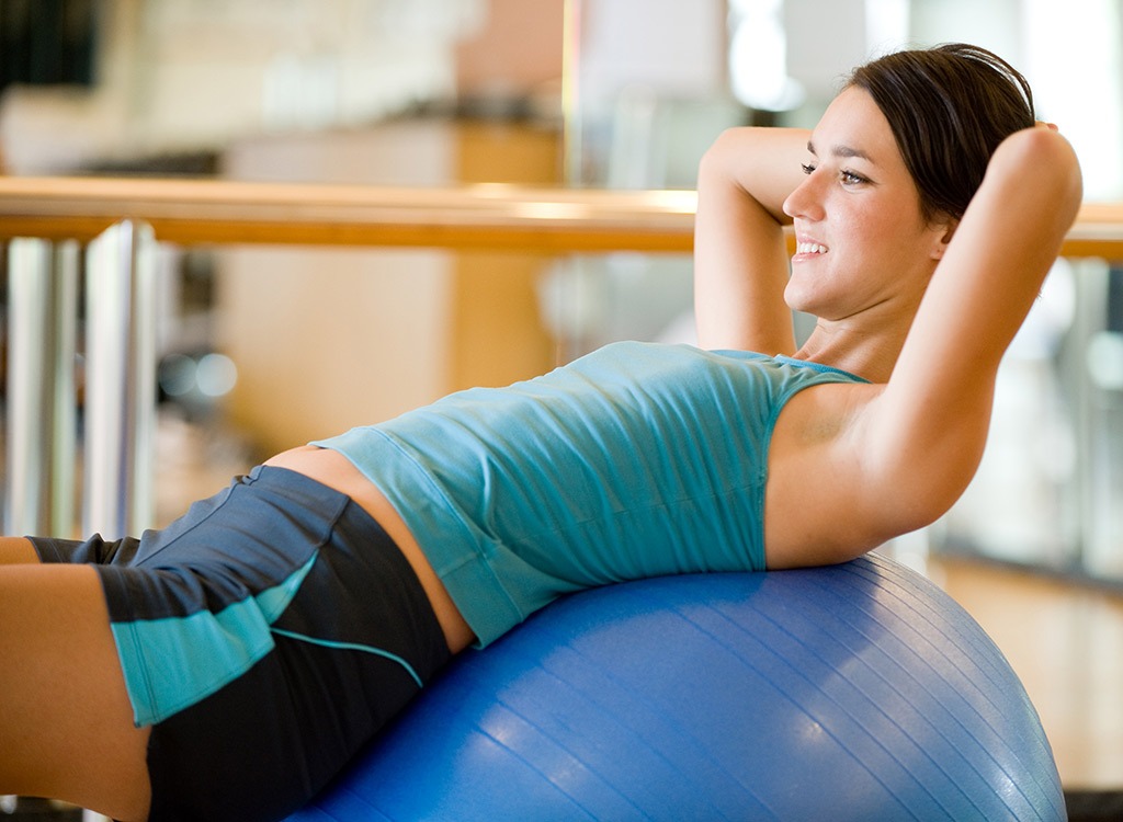 Woman crunching on inflatable ball