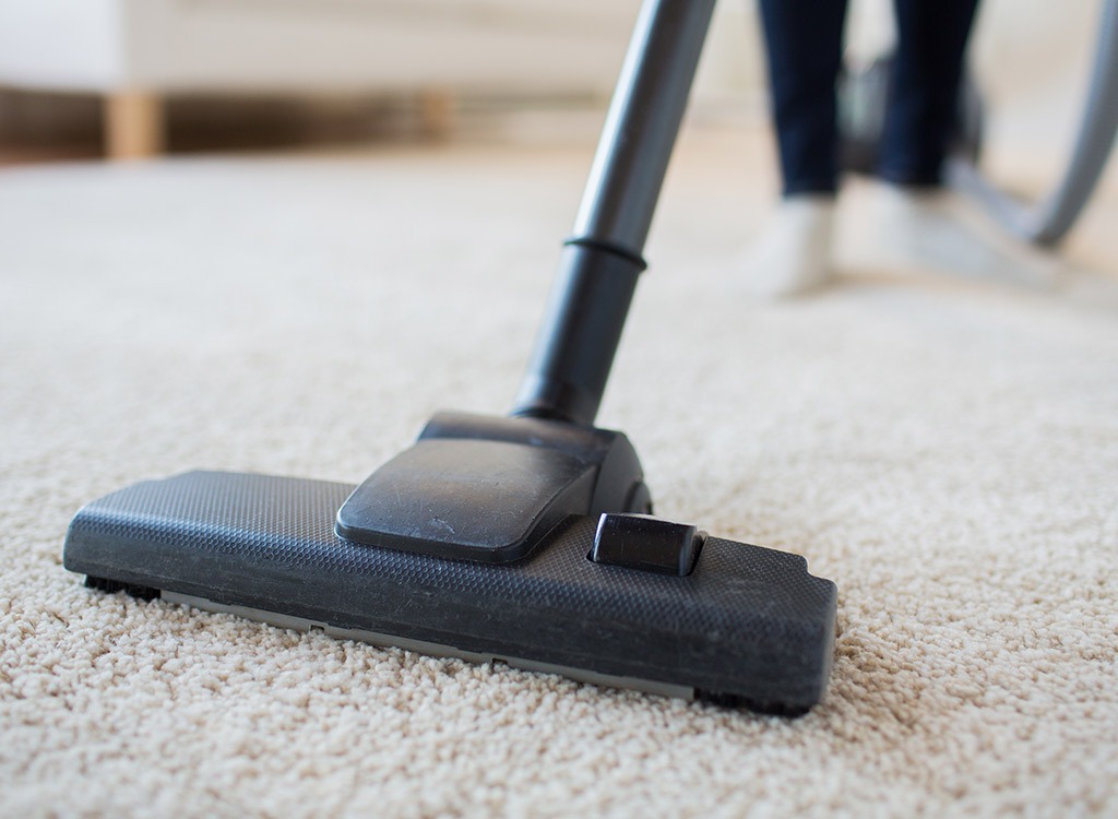 vacuuming the rug