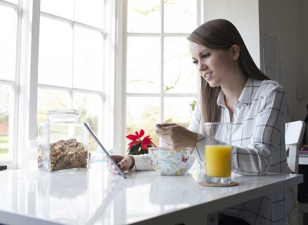 Woman eating breakfast - how to lose weight after 30