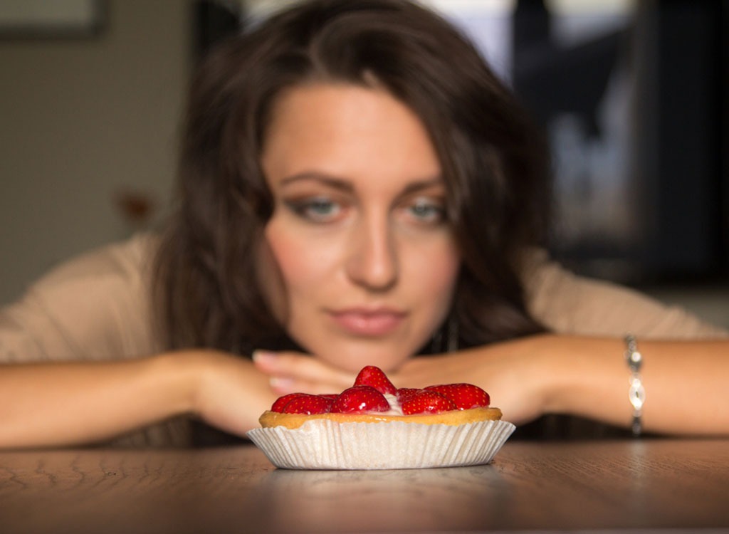 woman staring at dessert