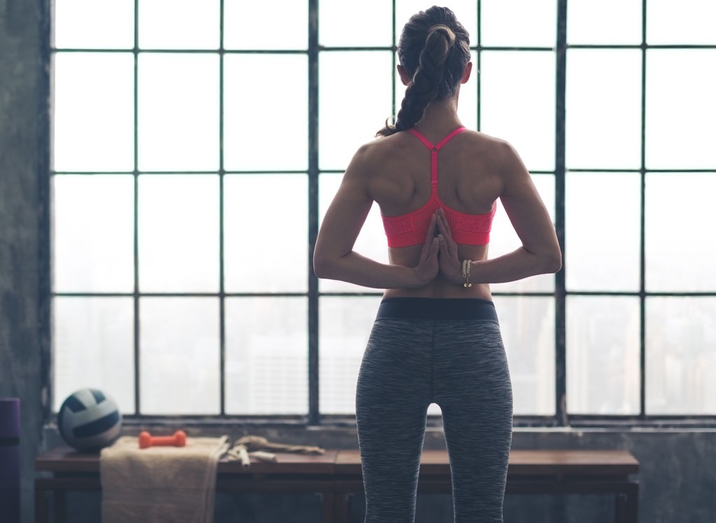 woman stretching at the gym