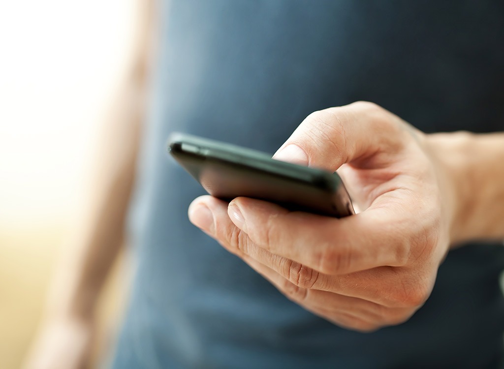 man holding cell phone