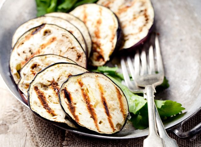 Grilled eggplant with fork