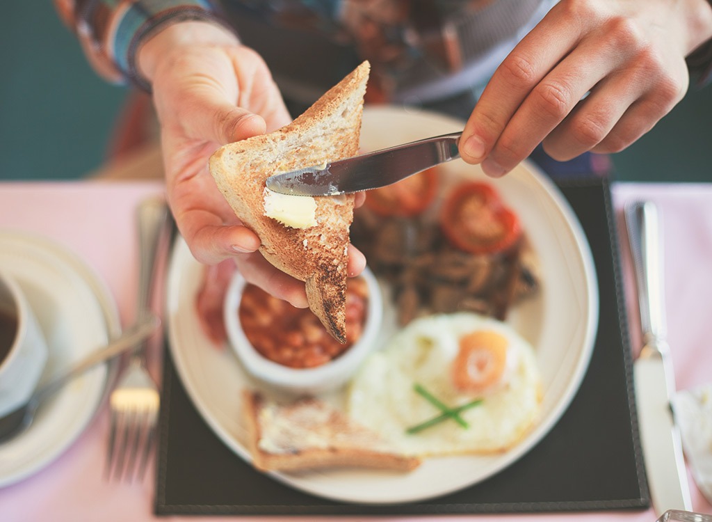 buttering toast breakfast