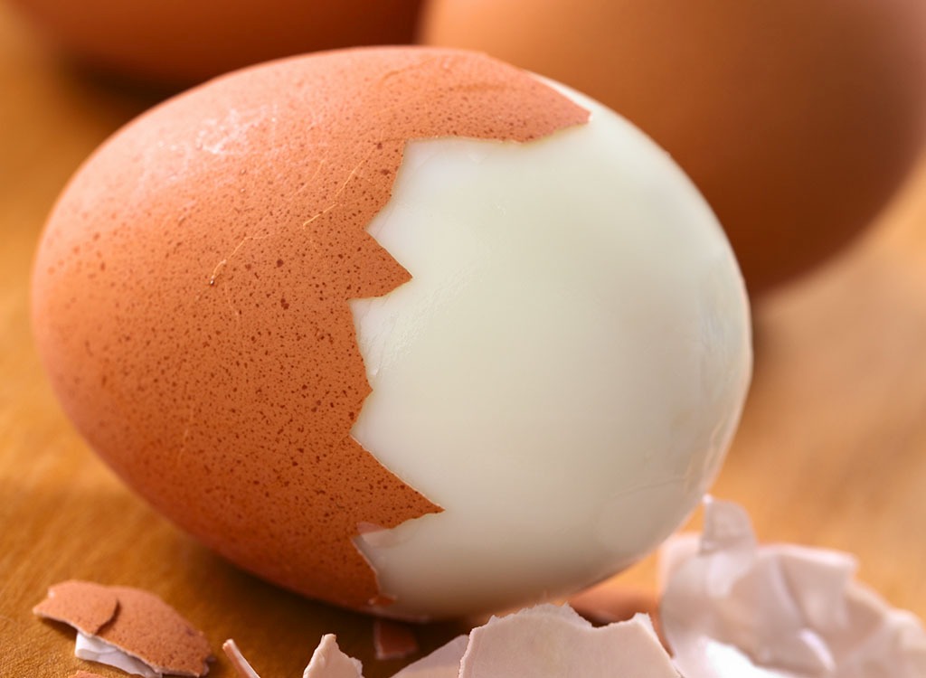 close up on peeled brown shell hard boiled egg