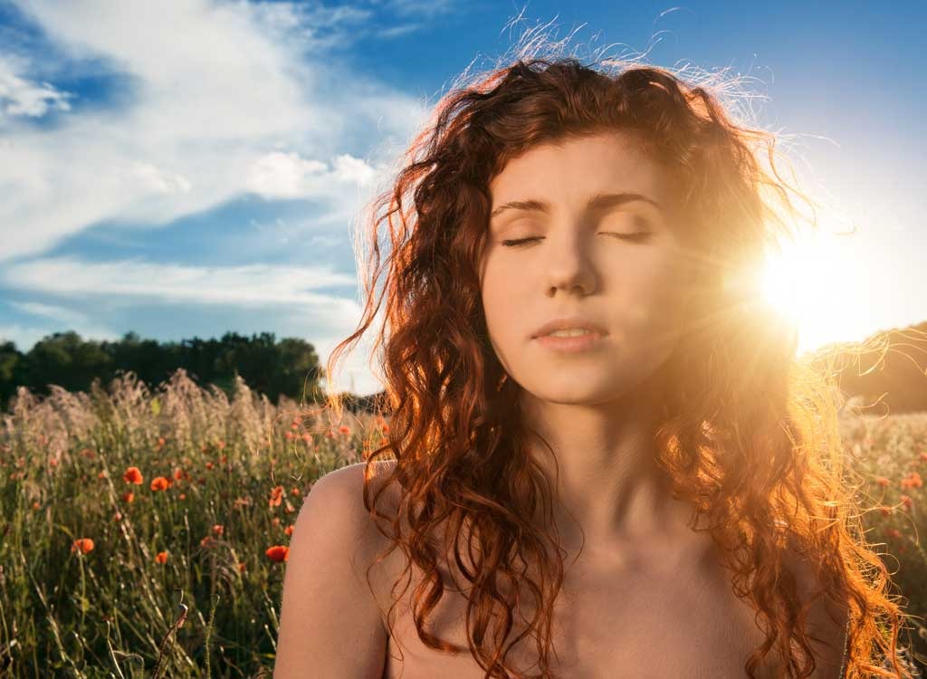 Woman in field - stop thinking about food