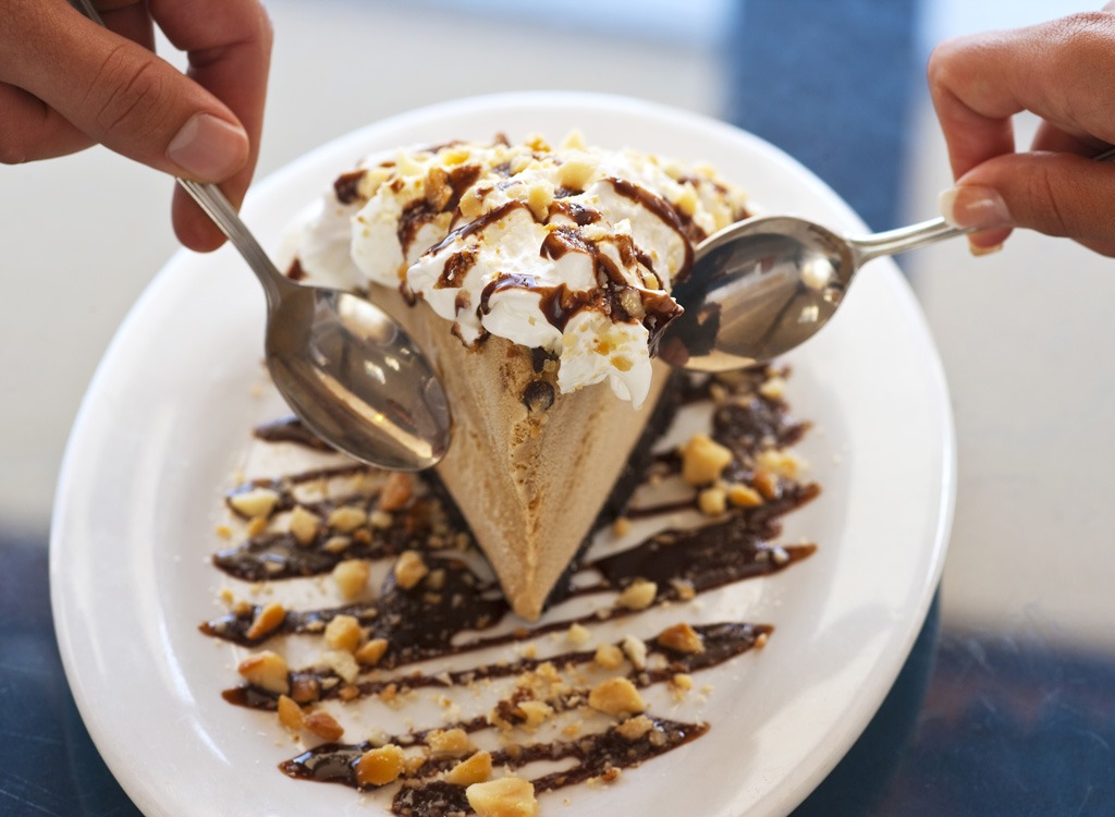 chocolate ice cream with whipped cream and nuts dessert