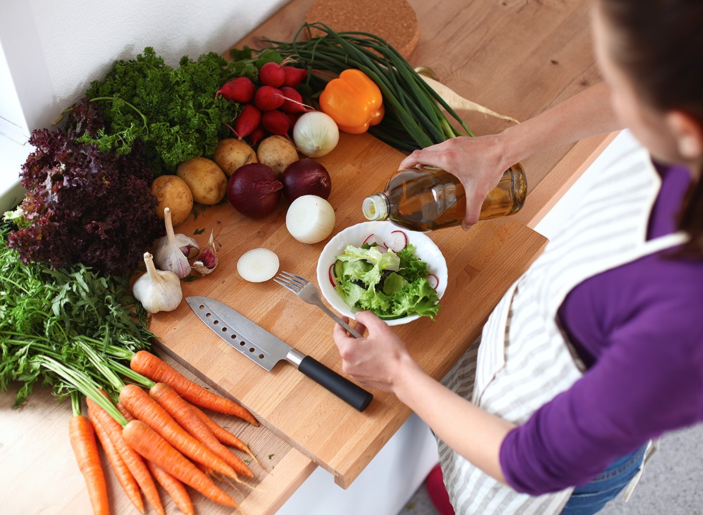 woman making salad