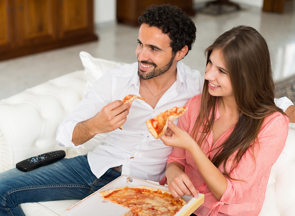 Couple eating pizza