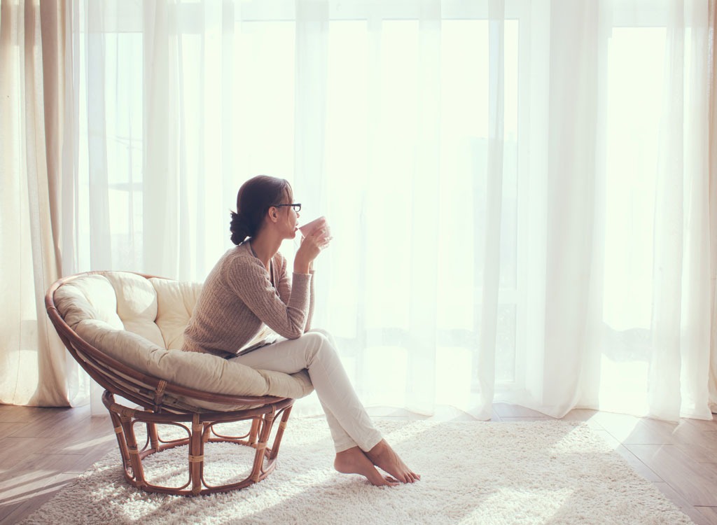 Woman sitting and drinking