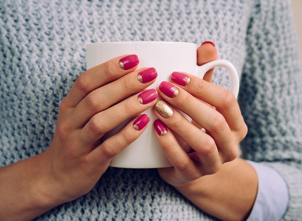 woman holding a coffee cup