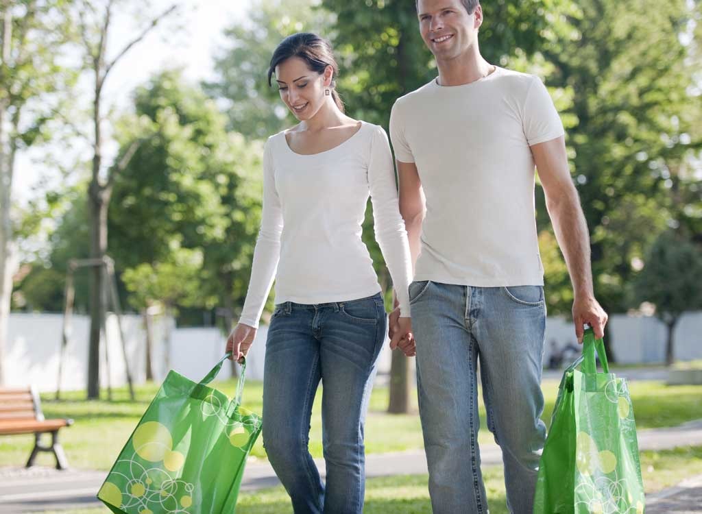 Man woman walking shopping bag