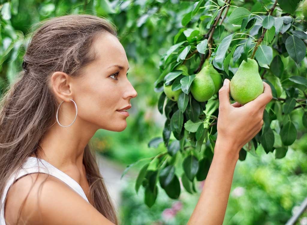 girl picking pear