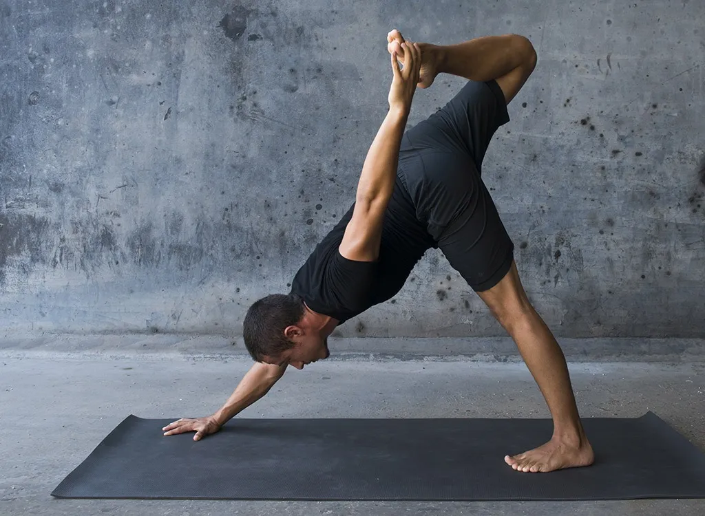 man practicing yoga