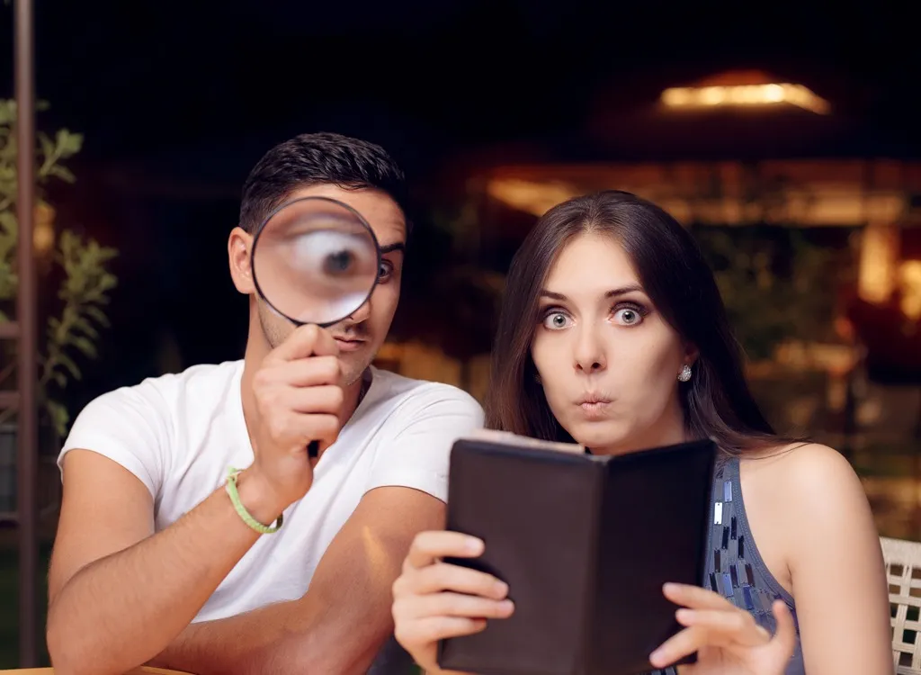 Couple looking at restaurant bill